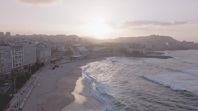 Aerial view of orzan beach and a coruna at sunset