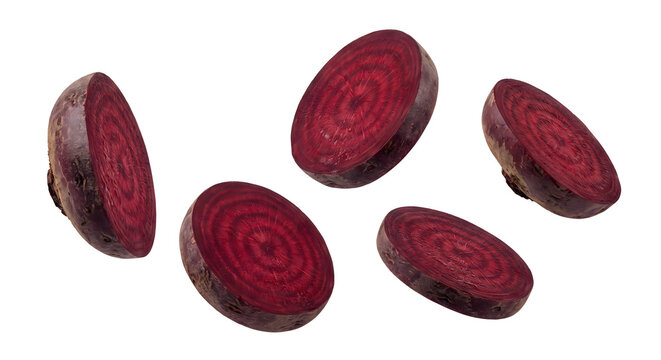 Levitating sliced red beetroot pieces on transparent background