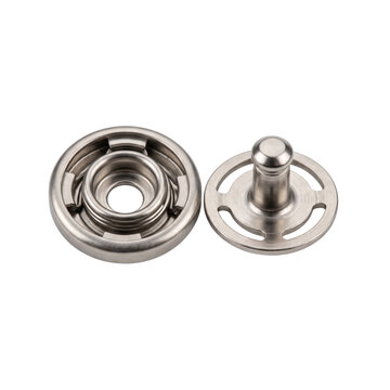 Two metal snap fasteners for clothing and upholstery, isolated on white background