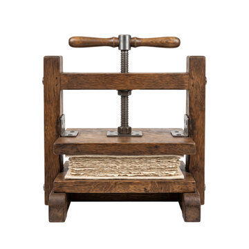 Antique wooden book press with aged paper sheets and metal screw mechanism