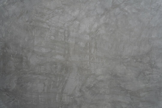 Gray concrete wall texture with raw polished cement surface background for modern industrial design and architecture concepts