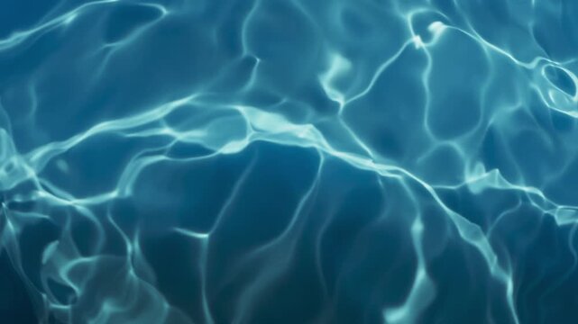 Fluid blue caustic light dances across a water surface. Gentle seamless loop for ocean themes, wellness content, and backgrounds. 3d render motion.