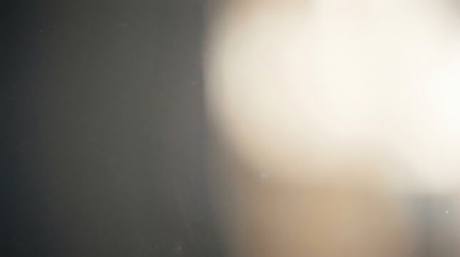 Soft bright light leak and bokeh effect on neutral dark background with abstract, background