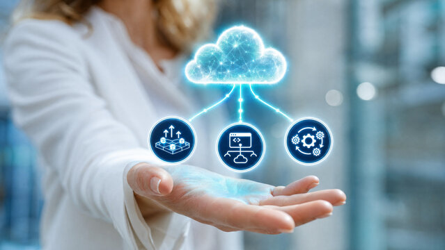 A hand holding a hologram displaying cloud computing technology with connected devices. The hologram shows a central cloud icon linked to three smaller icons representing data, computing.
