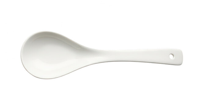 A single white ceramic soup spoon for kitchen dining isolated on transparent background