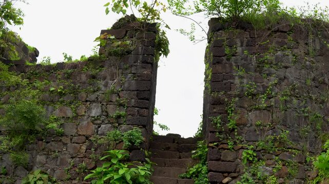 14 August, 2026, Vasai, Maharashtra, India &mdash; Weathered stone ruins forming part of the upper section of Vasai Fort.