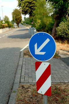 Keep left traffic sign representing mandatory direction and road safety