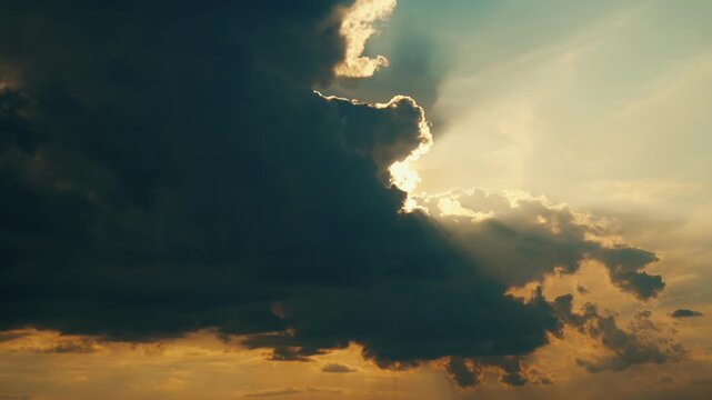 A celestial timelapse of a cloudy sky. Gloomy clouds cover the sun. The natural movement of clouds across the sky and the unique beauty.