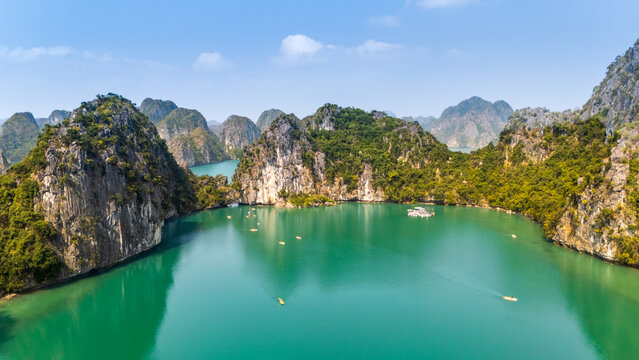 Turquoise lagoon among limestone karsts in Ha Long Bay