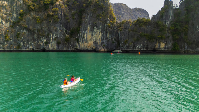 Kayak tour on emerald water in Ha Long Bay