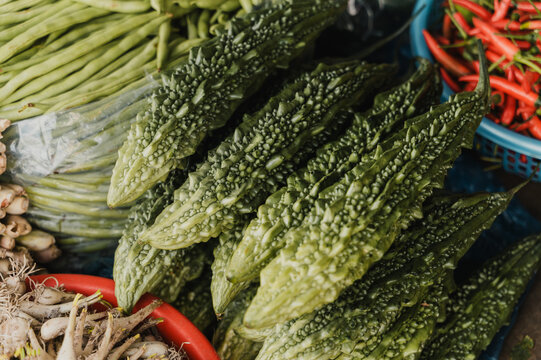Bitter melon for sale at a traditional vietnamese market