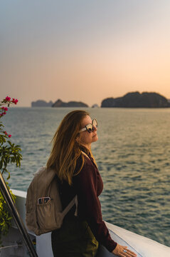 Woman portrait at sunset on Cat Ba Island coastline