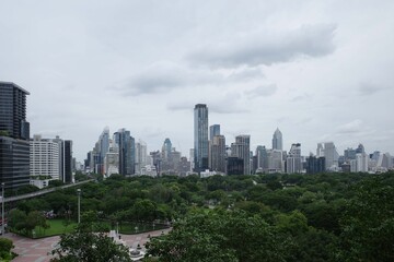 Fototapeta premium Bangkok skyline and modern skyscrapers in the background with lush urban neighborhood
