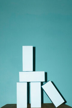 White cardboard package tower on blue background