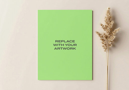 Vertical poster mockup displayed on a light-colored wall with dried grass decoration, minimalist interior design, realistic art presentation, graphic template, print