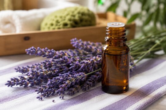 Lavender essential oil bottle with fresh flowers in spa setting