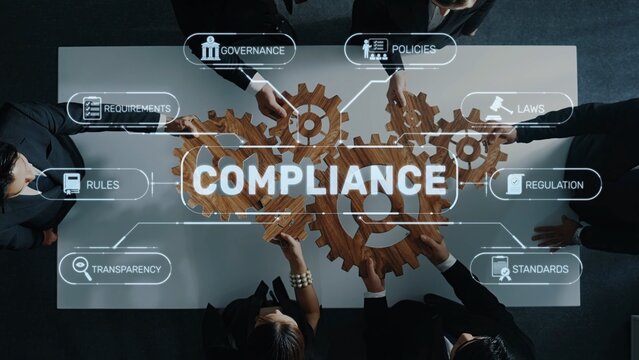 Aerial view of business professionals engaging in a compliance meeting. Wooden gears symbolize the interplay of governance, policies, and regulations in a corporate setting. Raster