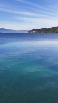 Bahia Mansa In Villa La Angostura Neuquen Argentina. Birds Eye View Of Stunning Dark River And Forest Trees. Winter Tourism. Snow Covered Mountain. Villa La Angostura Neuquen.