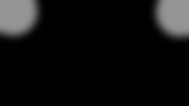 Two white glowing light spots in upper corners against solid black background motion soft circular positioned in the top over spot glow abstract corner dual spot glow abstract corner dual