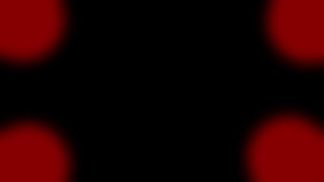 Abstract red glowing circles in corners on a black background loopable video motion graphic an video featuring circular shapes at each corner set against a solid dark backdrop