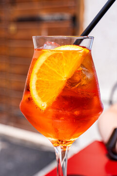 Aperol Spritz cocktail with orange slice and ice in glass