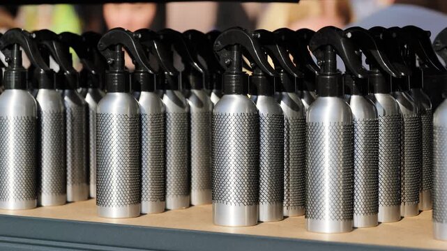 Repeating pattern of metallic spray atomizers, ready for branding and distribution
