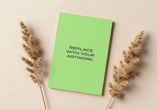 Vertical poster mockup on a light surface with dried wheat stalks, realistic print presentation for graphic design, branding, or editorial content, Template