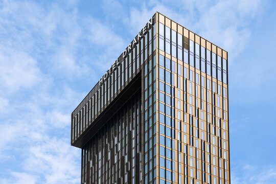 Gothenburg, Sweden - 13. August 2026: Modern high-rise Hotel Draken building featuring a glass and metal facade against a blue sky