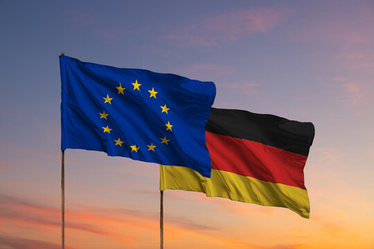 Flags of EU and Germany waving on flagpole in Berlin	