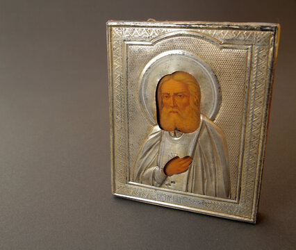 An old icon depicting Jesus Christ against a dark background; an icon as a symbol of Christianity.