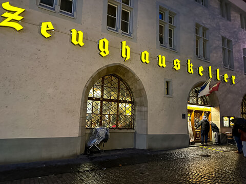 Zurich, Switzerland - March 14, 2026. Historic Zeughauskeller Restaurant Facade at Night in Zurich. An evening view captures the illuminated stone facade of the famous Zeughauskeller restaurant in Zur