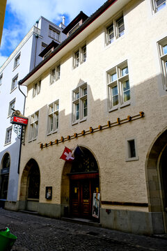Zurich, Switzerland - March 15, 2026. Historic Zeughauskeller Restaurant Building in Zurich Old Town. A low-angle exterior view of the famous Zeughauskeller restaurant, a historic 15th-century former 