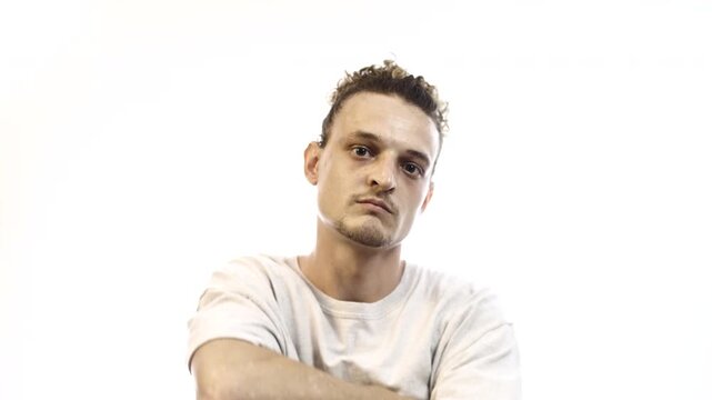 Confident Man with Arms Crossed Showing Different Facial Expressions on White Background