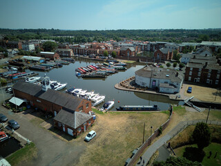Aerial drone view of Stourport-on-Severn town centre, Worcestershire, England. Bird's eye perspective of the historic market town, streets, red brick buildings, and surrounding landscape. © Xander Multimedia