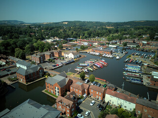 Aerial drone view of Stourport-on-Severn town centre, Worcestershire, England. Bird's eye perspective of the historic market town, streets, red brick buildings, and surrounding landscape. © Xander Multimedia