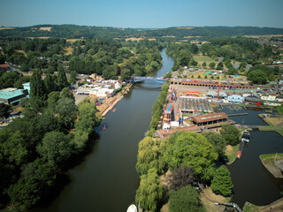 Aerial drone view of Stourport-on-Severn town centre, Worcestershire, England. Bird's eye perspective of the historic market town, streets, red brick buildings, and surrounding landscape. © Xander Multimedia