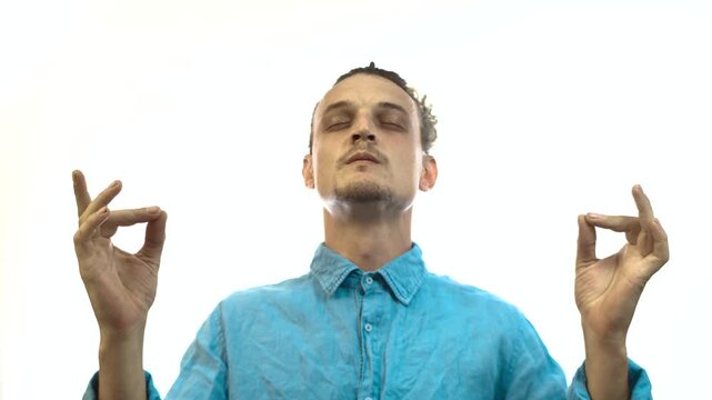 Man Meditating with Gyan Mudra and Eyes Closed on White Background