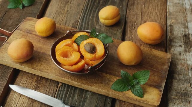Fresh apricots on wooden table. Summer seasonal fruits.