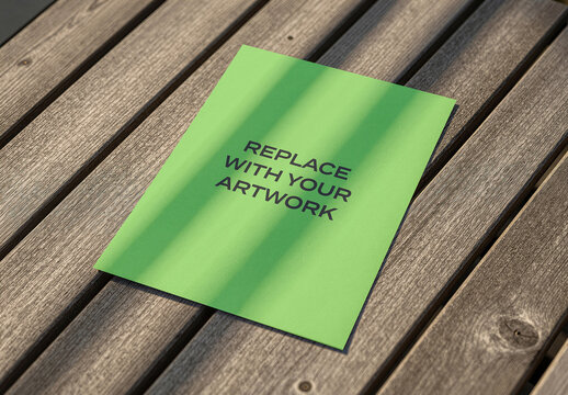 Brochure mockup placed on a wooden slatted surface with natural light, realistic print presentation for graphic design, branding, advertising, editorial, stationery, or marketing materials