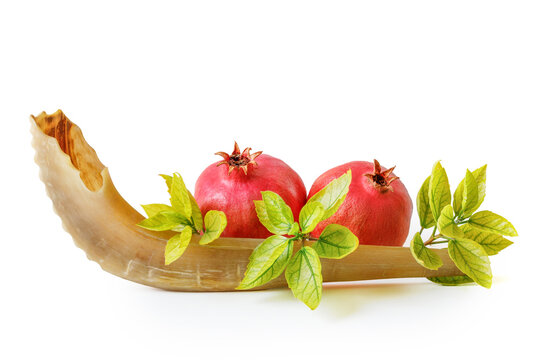 Shofar, pomegranate and pomegranate seeds. Rosh Hashanah (Jewish New Year holiday) concept.