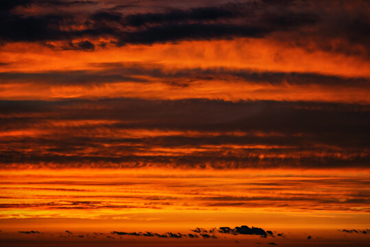 Colorful sunset sky with layered clouds