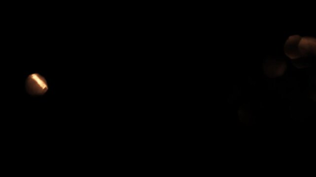 Light leaks 4k footage on black background. Natural lighting lamp rays bokeh effect. Light organic leaks effect background animation stock footage. 