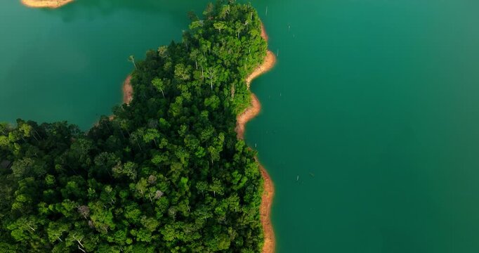 Thailand Stunning Aerial Sunrise of Cheow Lan Lake Emerging Through Dense Morning Mist &ndash; Khao Sok National Park
