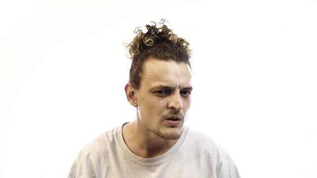 Confused Man Asking &ldquo;Excuse Me?&rdquo; with Furrowed Brows on White Background