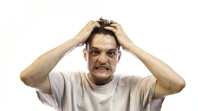 Frustrated Man Pulling His Hair and Grabbing His Head on White Background