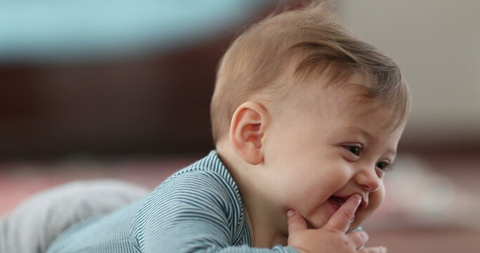 Bashful cute baby infant smiling