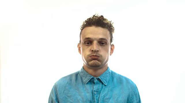 Exasperated Man Sighing and Looking Judgmental on White Background