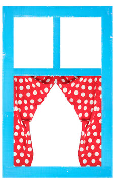 Blue wooden window frame with red curtains with white polka dots
