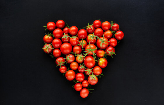 Fresh tomatoes vegetables, Fresh Harvest Ripe red farm organic cherry tomato on dark old background	