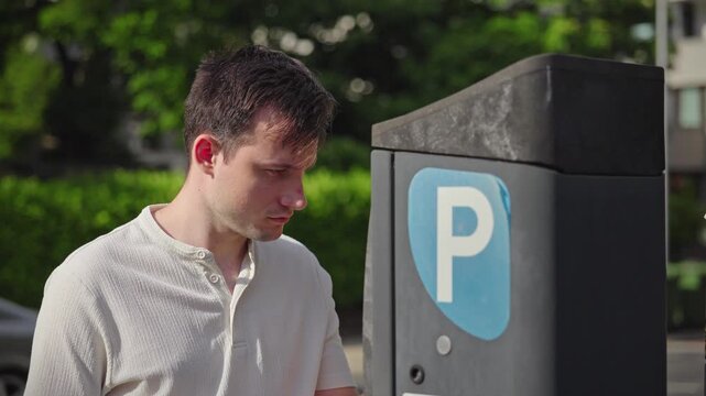 Man Beside Parking Meter on Sunny Street